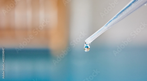chemical dropper with water in laboratory photo