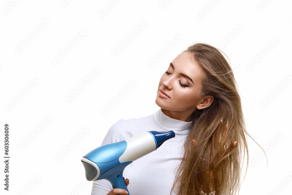 Portrait of attractive cheerful girl drying long hair Portrait of attractive cheerful girl drying long hair