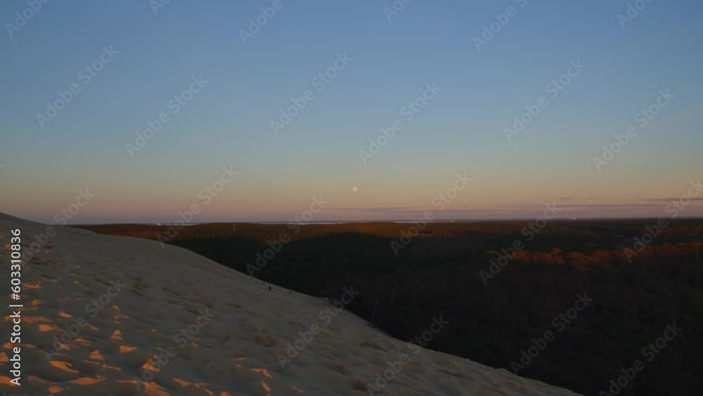 Dusk at the Dune of Pilat in Arcachon Bay, France, pastel colors sky, moonrise Dusk at the Dune of Pilat in Arcachon Bay, France, pastel colors sky, moonrise