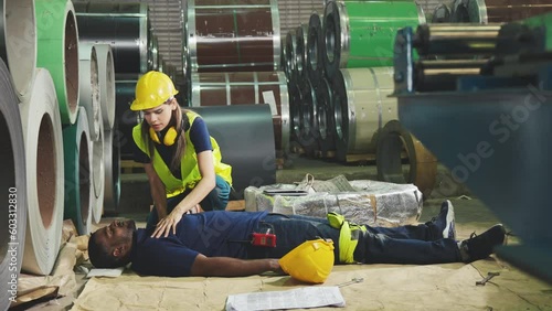 Emergency on worker in factory, First aid emergency CPR on heart attack Man , One part of the process resuscitation - Healthcare concept.