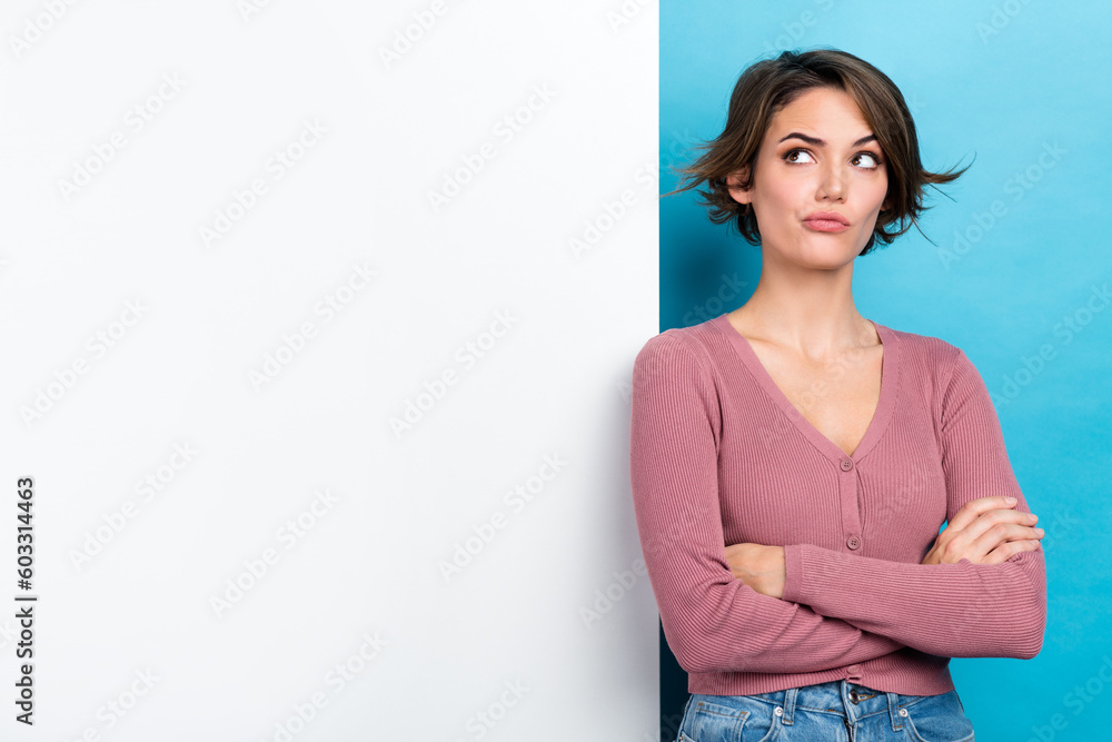Photo of minded thoughtful woman with bob hairdo dressed pink sweater arms folded look empty space isolated on teal color background Photo of minded thoughtful woman with bob hairdo dressed pink sweater arms folded look empty space isolated on teal color background