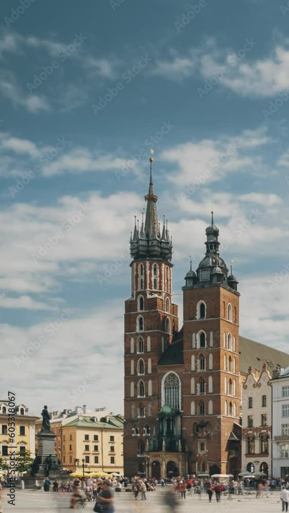 Krakow, Poland. St. Mary's Basilica And Cloth Hall Building. Famous Old Landmark Church Of Our Lady Assumed Into Heaven. UNESCO World Heritage Site. vertical, vertical footage, vertical video. Krakow, Poland. St. Mary's Basilica And Cloth Hall Building. Famous Old Landmark Church Of Our Lady Assumed Into Heaven. UNESCO World Heritage Site. vertical, vertical footage, vertical video.