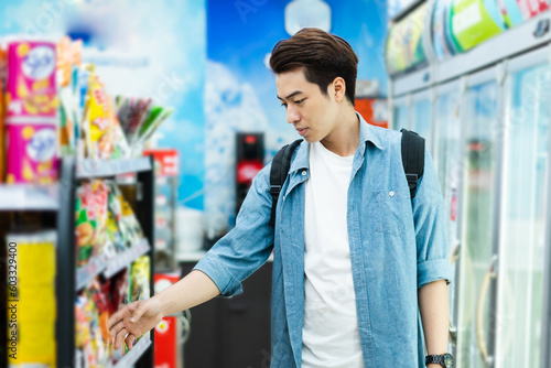image of Asian man shopping at a convenience store