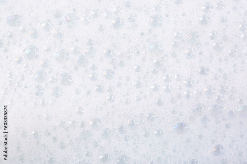 Soap foam close-up as a background. Facial cleanser foam bubbles. A foam party.