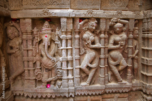 Carved idol on the outer wall, Hatkeshwar Mahadev, 17th century temple, the family deity of Nagar Brahmins. Vadnagar, Gujarat, India photo