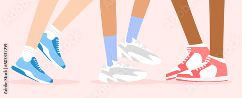 Different skin color legs in fashion sneakers. Cool bright sports shoes with socks for for man and woman. Footwear concept. Vector illustration in trendy flat style isolated.