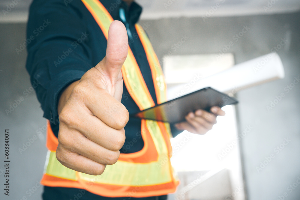 Close-up of thumbs-up of architects, designers of buildings with great achievements. Close-up of thumbs-up of architects, designers of buildings with great achievements.