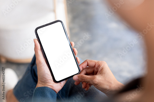 cell phone blank white screen mockup.hand holding texting using mobile on desk at office.background empty space for advertise.work people contact marketing business,technology © panitan