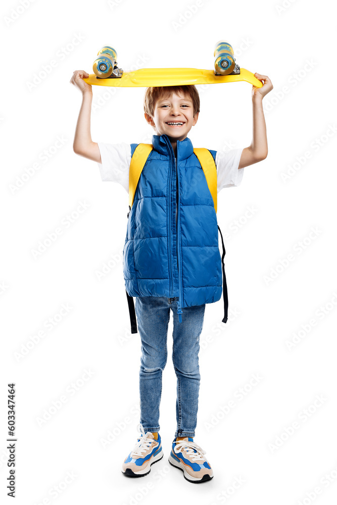 Carefree blonde boy holding yellow longboard on the head over white background. Carefree blonde boy holding yellow longboard on the head over white background.