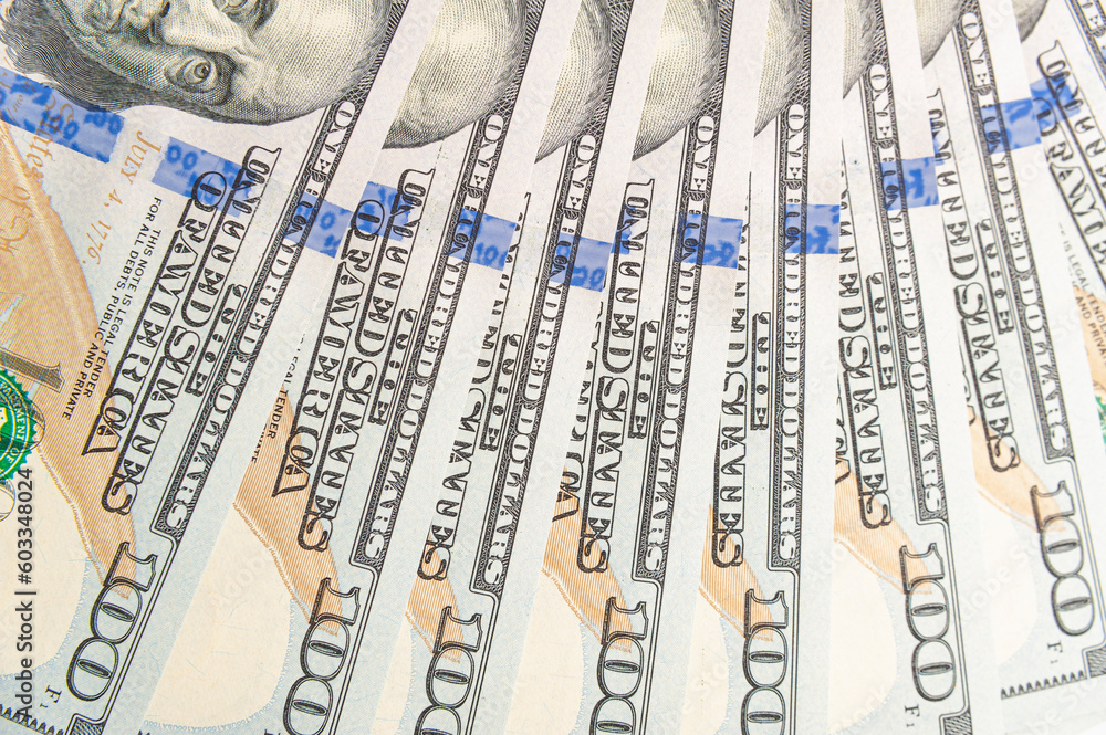 Wealth in Detail: Close-Up of Eight 100 Dollar Bills in Focus Wealth in Detail: Close-Up of Eight 100 Dollar Bills in Focus