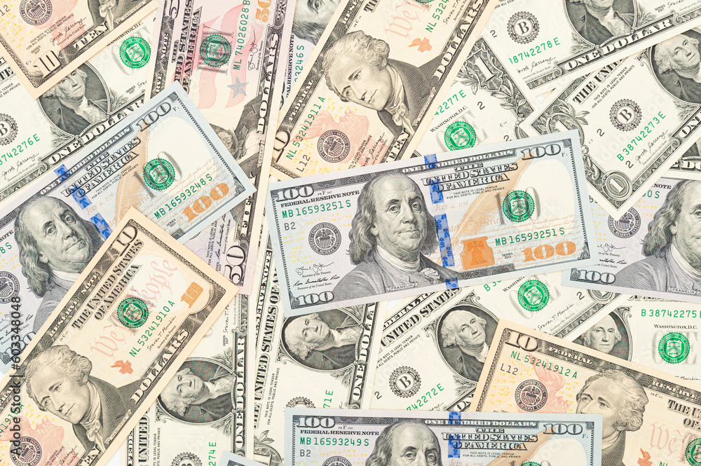 Scenes of Abundance: A Visual Composition with Scattered 1, 10, 50, and 100 Dollar Bills Scenes of Abundance: A Visual Composition with Scattered 1, 10, 50, and 100 Dollar Bills
