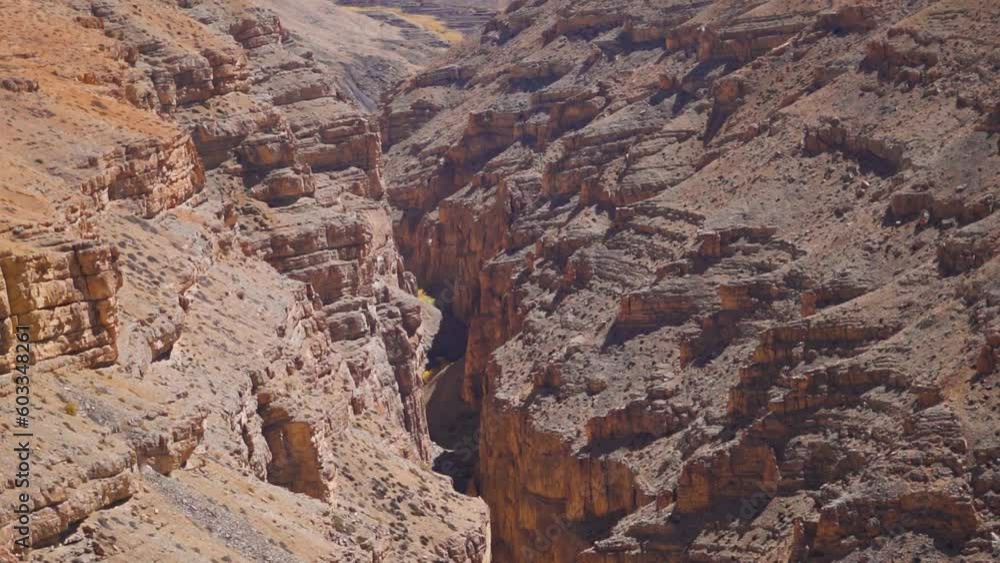 Landscape shot of a canyon between the two mountains as seen on the way to Komic village in Spiti Valley, Himachal Pradesh, India. View of canyon in between the Himalayan mountains in Spiti Valley. Landscape shot of a canyon between the two mountains as seen on the way to Komic village in Spiti Valley, Himachal Pradesh, India. View of canyon in between the Himalayan mountains in Spiti Valley.