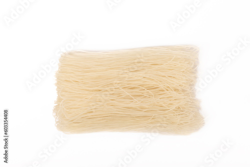 Rice noodles isolated on white background. Raw funchose noodles. Thai dried rice noodles.