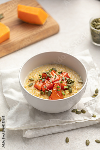 Portion of healthy breakfast millet porridge with baked pumpkin