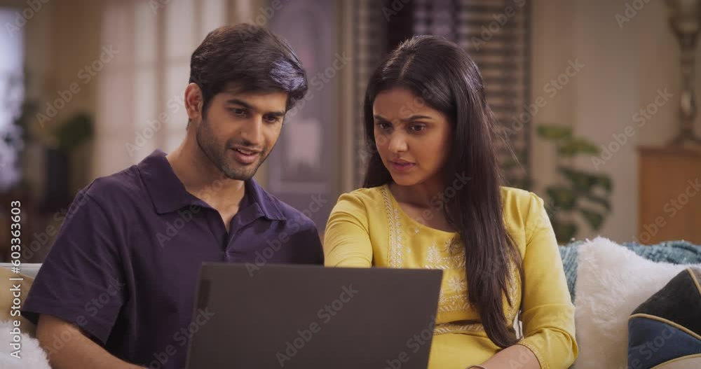 Enthusiastic Indian couple browsing online stores for fashionable outfits, latest electronics, or exclusive travel offers. Sharing quality time while exploring new hobbies and home décor items. Enthusiastic Indian couple browsing online stores for fashionable outfits, latest electronics, or exclusive travel offers. Sharing quality time while exploring new hobbies and home décor items.