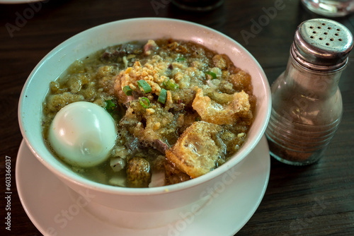 Batchoy, a Filipino noodle soup of pork offal, crushed pork cracklings, chicken stock, beef loin and round noodles. Originating in the district of La Paz, Iloilo City. photo