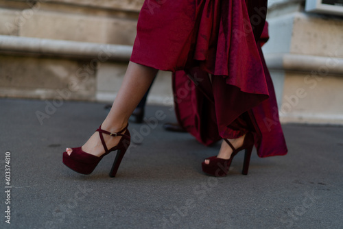 Red block heel shoes under a red glamorous dress
