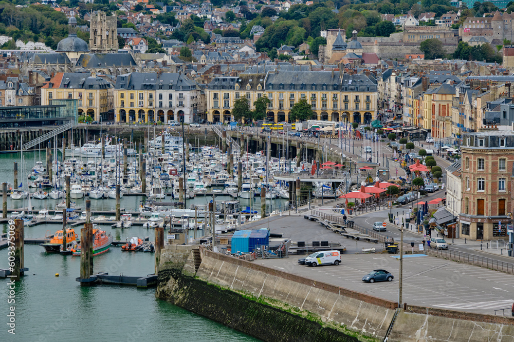 Dieppe, Normandy, France - September 19 2022: A panoramic high angle view of the boats and yachts in the marina with historic port buildings in the background.