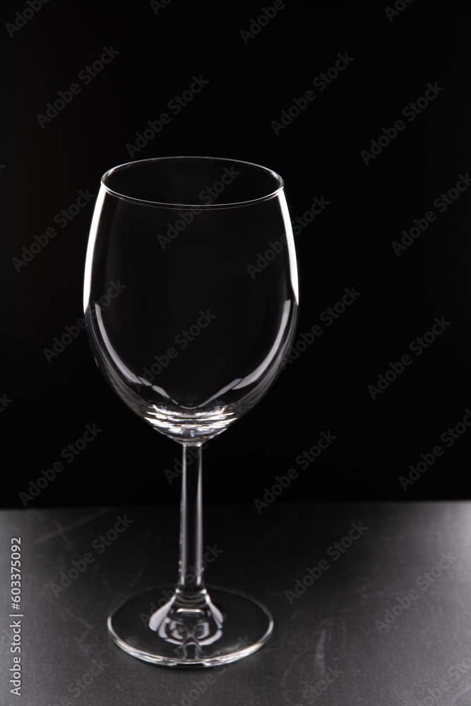 photo glass of wine on a black background photo glass of wine on a black background
