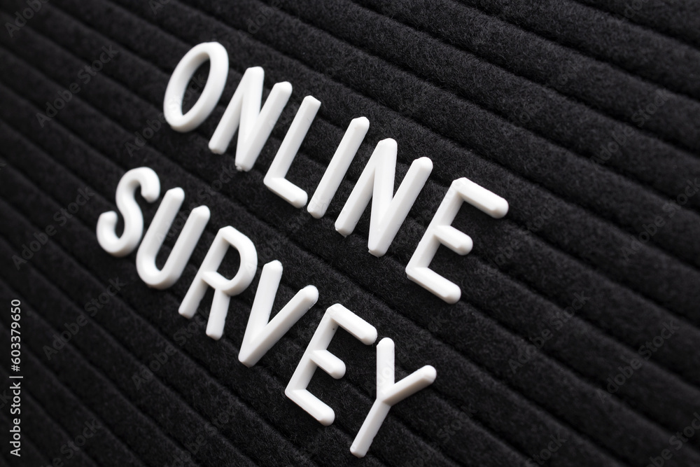 Fototapeta premium The phrase online survey on black letter board