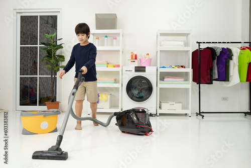 Wallpaper Mural little boy with his father use vacuuming the room. Father and son doing the cleaning in the house. Torontodigital.ca