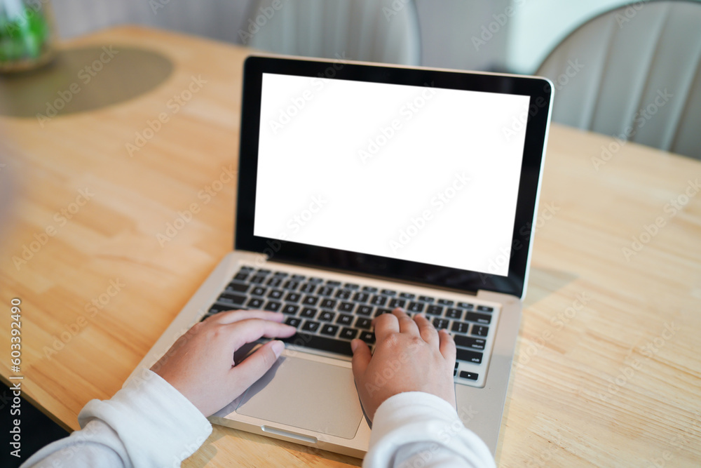 Woman Working by using laptop blank screen computer . Hands typing on a keyboard.technology e-commerce concept. Woman Working by using laptop blank screen computer . Hands typing on a keyboard.technology e-commerce concept.