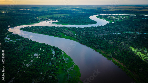 aerial view of pantanal wetland Brazil with jungle forest stream river at sunset  © Michele