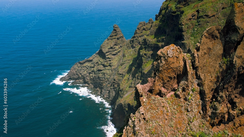 Epic green mountain landscape on ocean coastline, hiking trail in Anaga rural park. Chinamada Tenerife Canary Islands Spain.