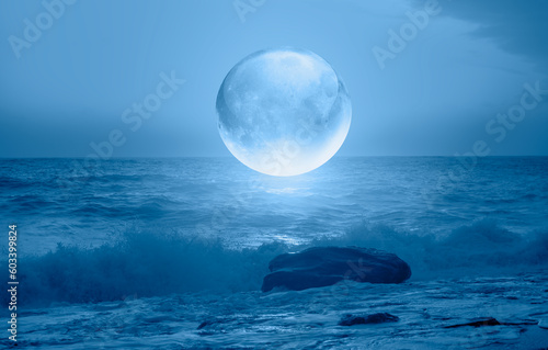 Photography Full crystall moon (or glass ball moon) rising over empty sea with night