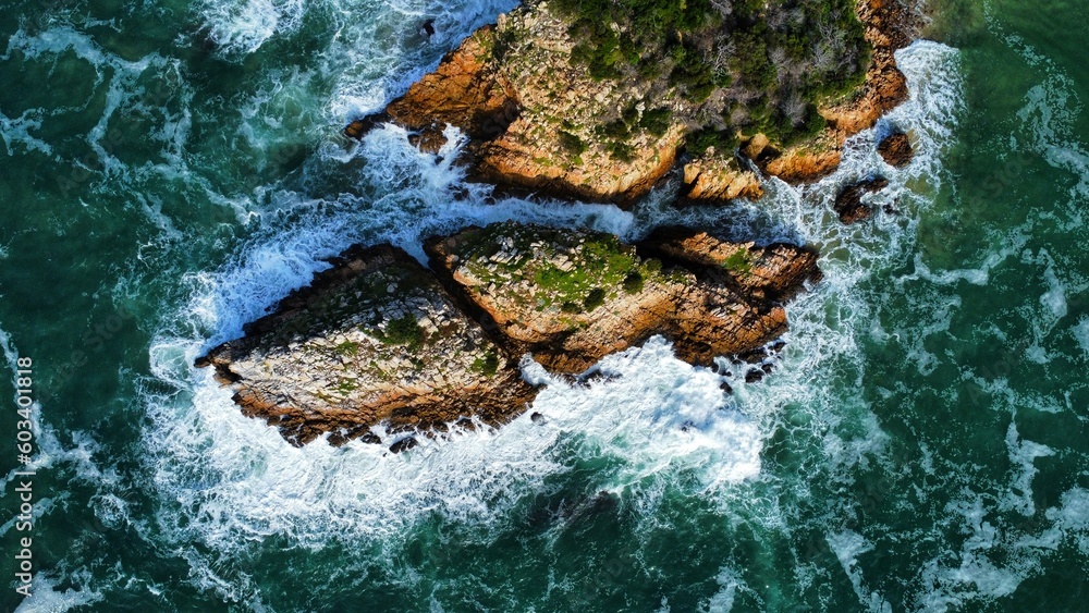 Drone Photo of Rock island getting hit by waves