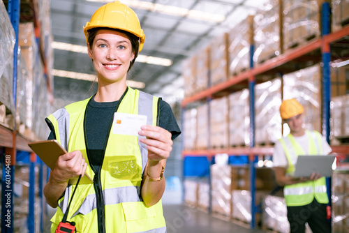 Картината върху платно African-American woman foreman with positive thinking and carry credit cards for convenience at wholesale warehouse stores