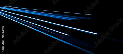 blue lines of car lights on black background