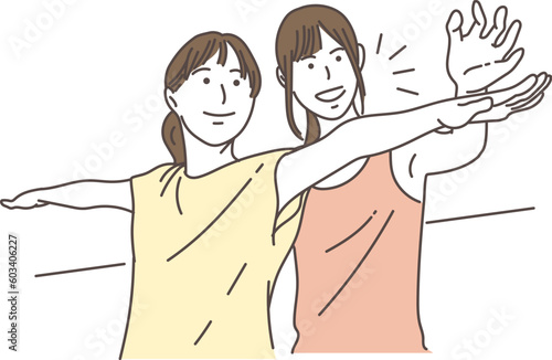 ヨガをする女性と指導するインストラクター
