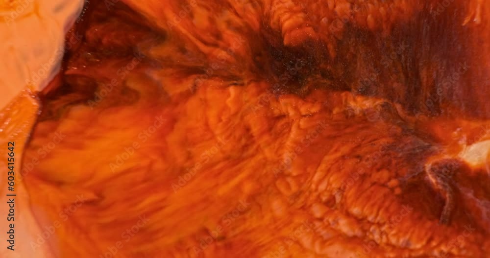 Red orange paints splash abstract art background, close up. Bright fire ink spread. Colorful orange liquid color flow texture. Vivid acrylic paint water. Beautiful orange backdrop. 4k vertical video Red orange paints splash abstract art background, close up. Bright fire ink spread. Colorful orange liquid color flow texture. Vivid acrylic paint water. Beautiful orange backdrop. 4k vertical video