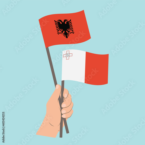 Flags of Albania and Malta, Hand Holding flags © Настасья Стось