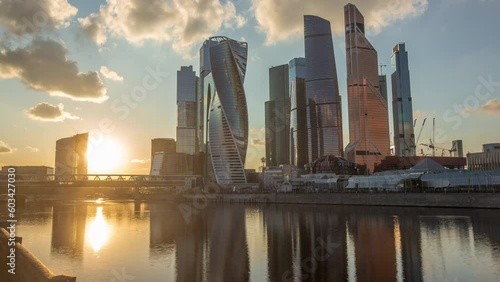 Sunset at Moscow City business center skyscrapers office buildings and luxury apartments timelapse hyperlapse. Orange clouds over towers evening panorama. Modern european architecture