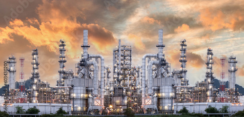 .Industrial oil refinery and petrochemical plants Refinery plants Natural gas storage tanks Petroleum industry Yellow sunrise background photo