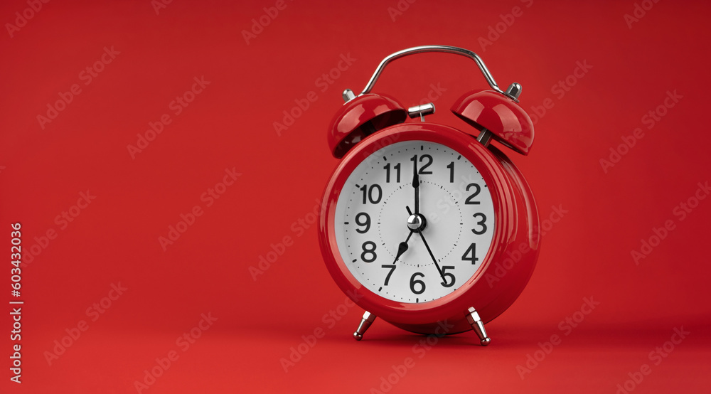 Red alarm clock on a red background. Red alarm clock on a red background.