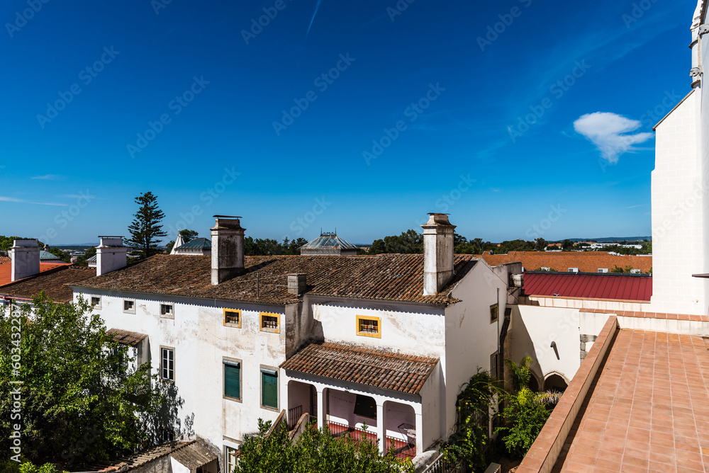 Cityscape of Evora with typical houses painted in white and ceramic tiled roofs. Alentejo, Portugal