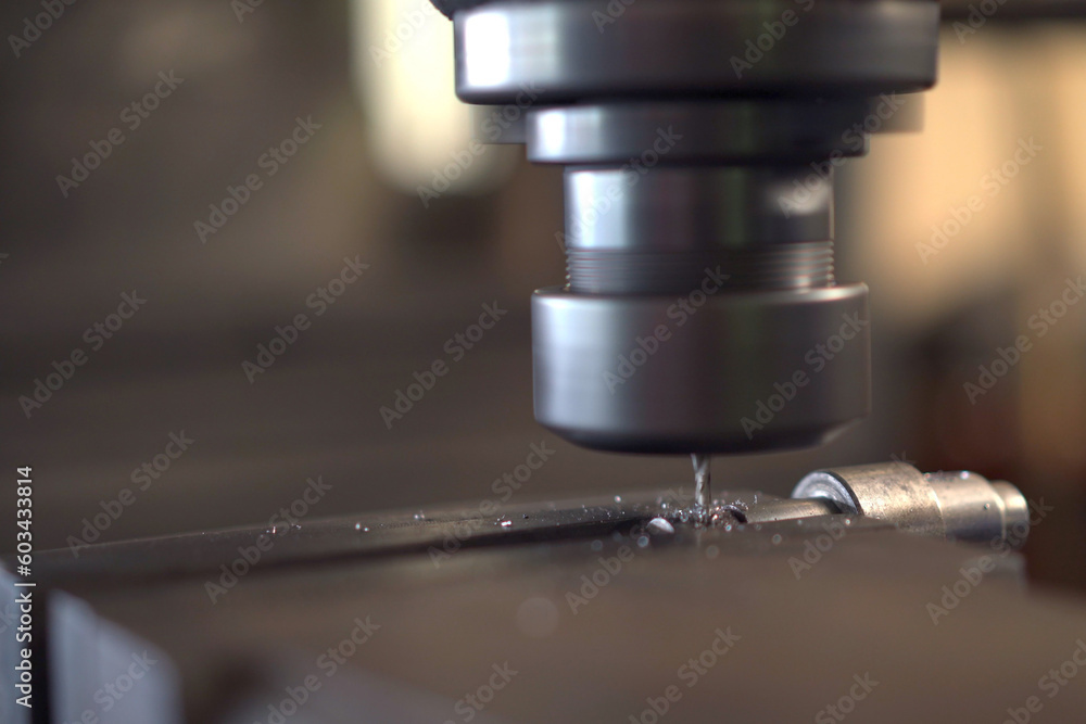 Close up shoot showing a drilling - lathing machine in operating.