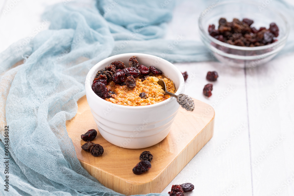 Baked Oatmeal with Dried Fruits like Sultanas, Raisins and Grapes, single portion meal made from oats