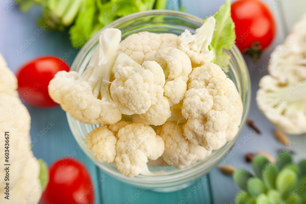 sliced cauliflower on wood background sliced cauliflower on wood background