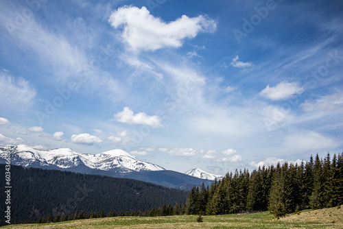 Fototapeta Naklejka Na Ścianę i Meble -  Landscape with lake and mountains. Blue sky and trees. Forest in the mountains. Mountain trip. Travel. Carpathian mountains