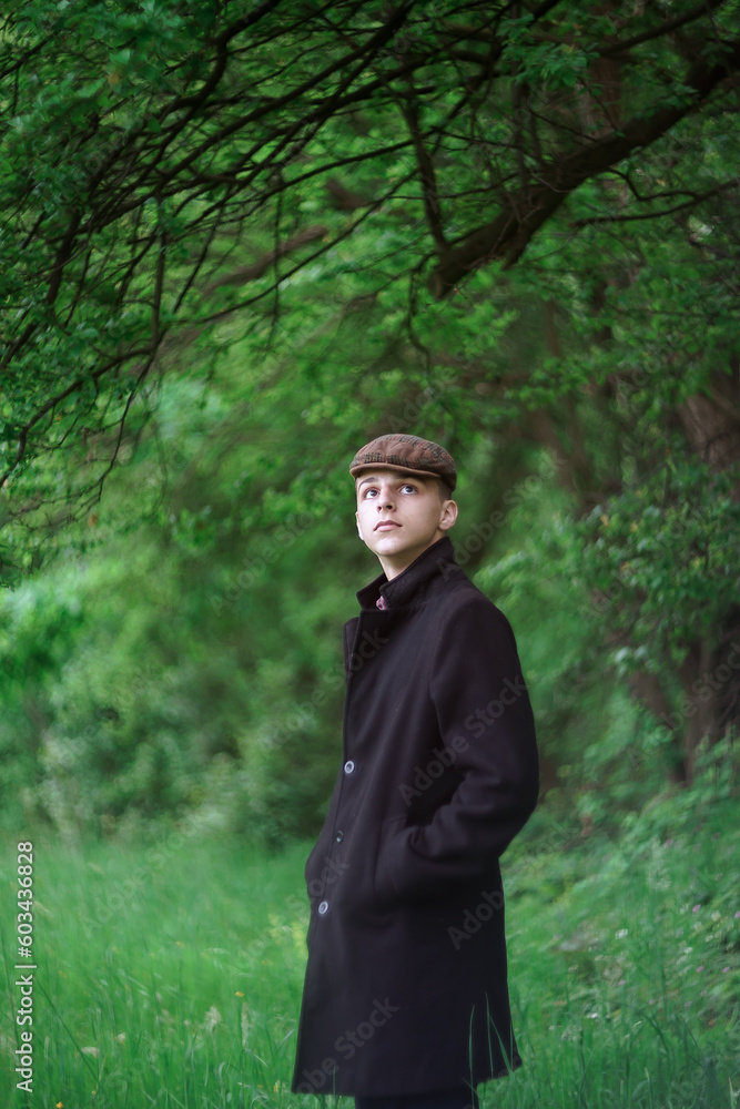 portrait of a handsome boy outside in natural light