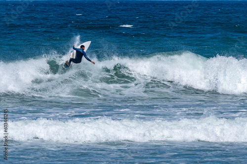 Surfer riding waves in Furadouro Beach © homydesign