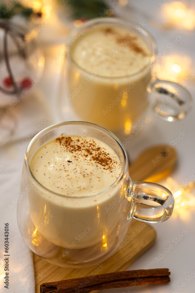 Creamy Delight: Indulge in Festive Eggnog, a Rich and Spiced Holiday Drink, Brimming with Cream, Eggs, and Winter Flavors for a Classic and Decadent Seasonal Treat Creamy Delight: Indulge in Festive Eggnog, a Rich and Spiced Holiday Drink, Brimming with Cream, Eggs, and Winter Flavors for a Classic and Decadent Seasonal Treat