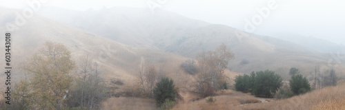 panorama of the mountains in the foggy morning