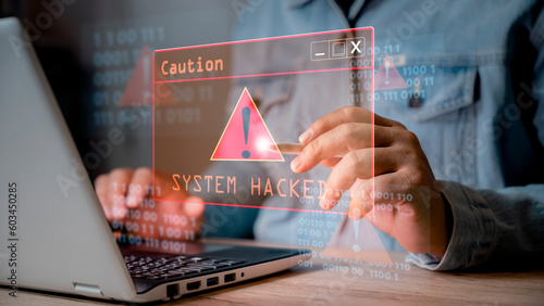 System hacked alert after cyber attack on computer network. user is using computer with triangle caution warning sign for notification error. cyber crime, cyber security, Ransomware, Phishing, Spyware