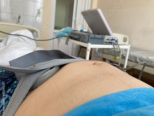 Cardiotocography. Pregnant Woman On Hospital Couch During Medical Control Cardiotocography.