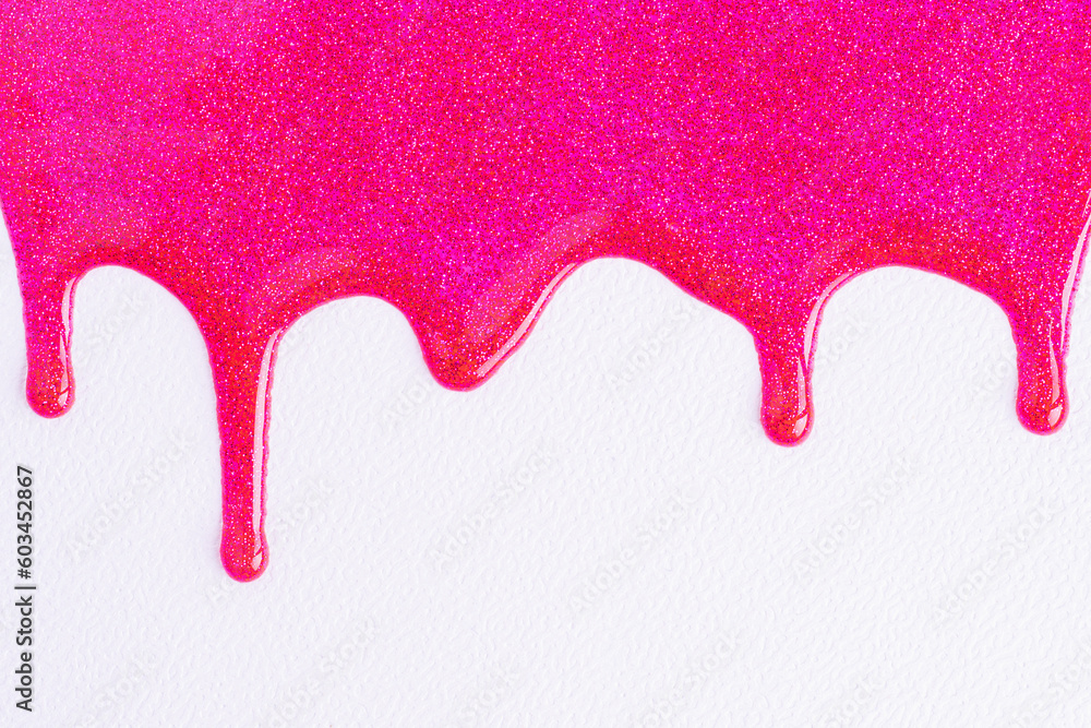Pink glitter sparkle confetti background liquid drops of paint color flow down on white canvas. Dark pink glitter paint dripping on the white wall